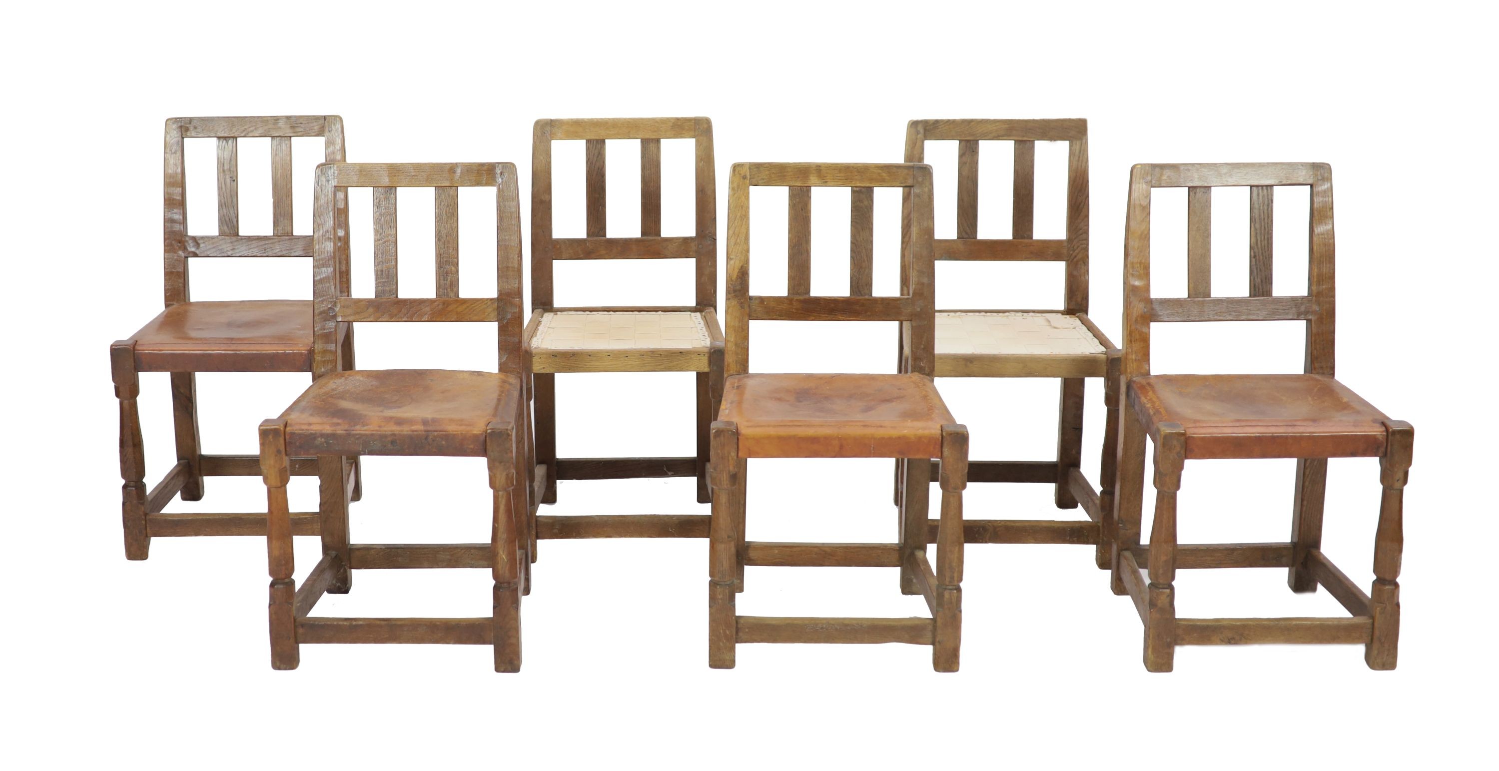 A set of six Robert Thompson 'Mouseman' oak dining chairs